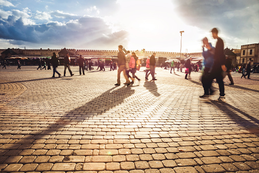 People walking in town square in Meknes, Morocco.