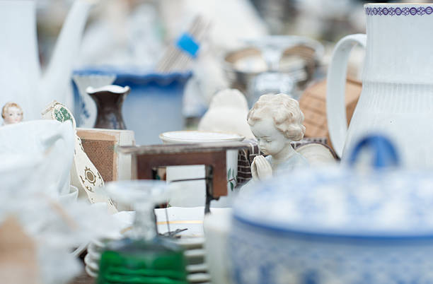 Doll of china praying at flea market stock photo