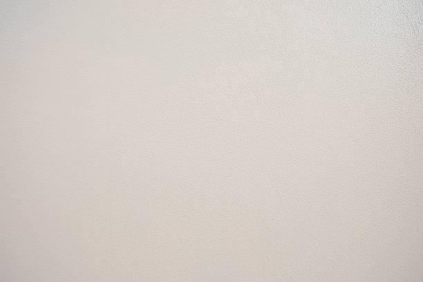 istock New and clean warm white textured wall. 530832692
