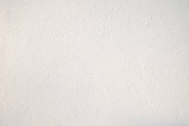 istock New and clean warm white textured wall. 530833092
