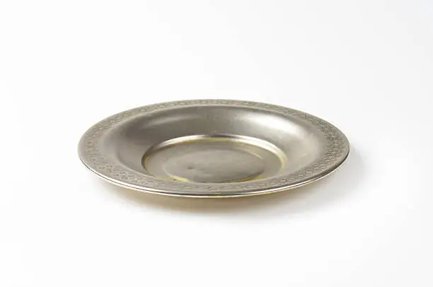 Vintage metal saucer plate with decorative rim
