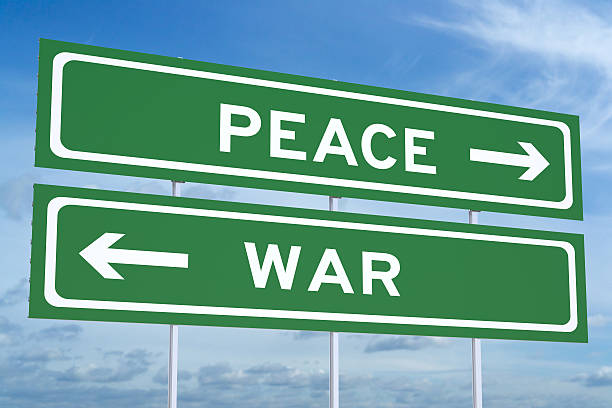 istock war or peace concept on the road signpost 3D rendering 530833144