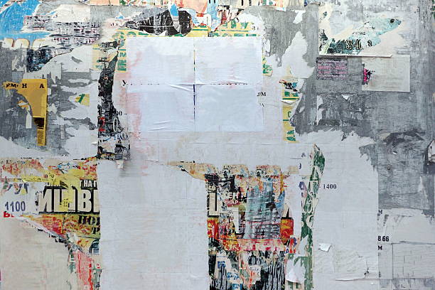 istock Old Urban Street Billboard With Torn Posters And Stickers 530833222