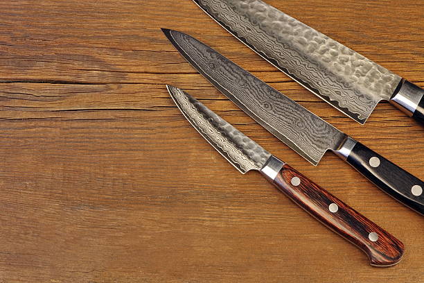 istock Japanese Professional Kitchen Knives On The Wood Cutting Board 530833694