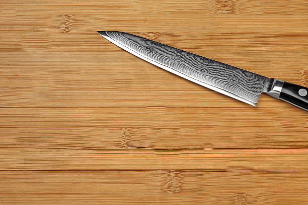 istock Japanese Professional Kitchen Knife On The Bamboo Cutting Board 530833842