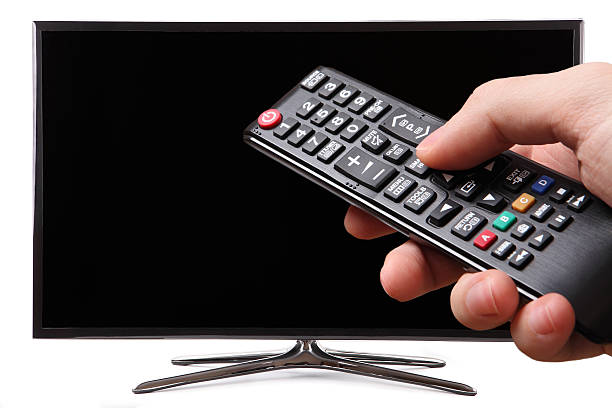 istock TV remote control with a smart tv in the background 530839269