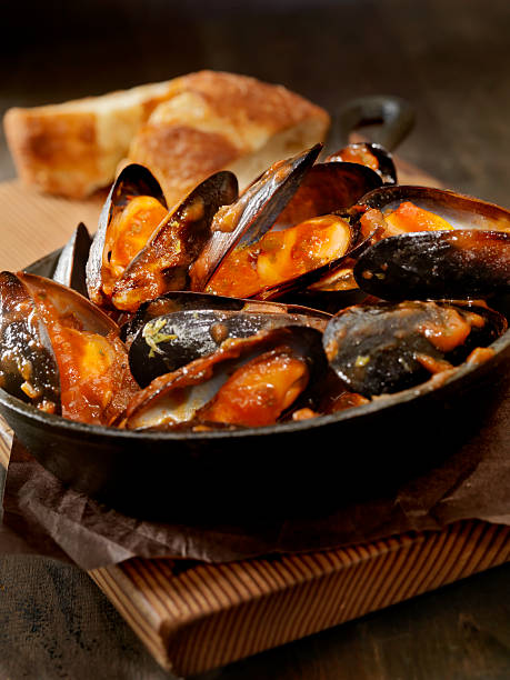 Mussels in Tomato Sauce with Fresh Parsley and Bread -Photographed on Hasselblad H3D2-39mb Camera