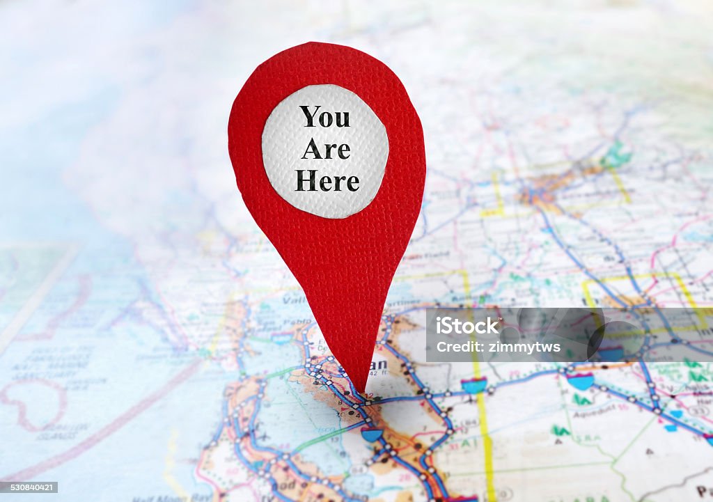 You Are Here locator Red locator symbol on a map with You Are Here text Accuracy Stock Photo