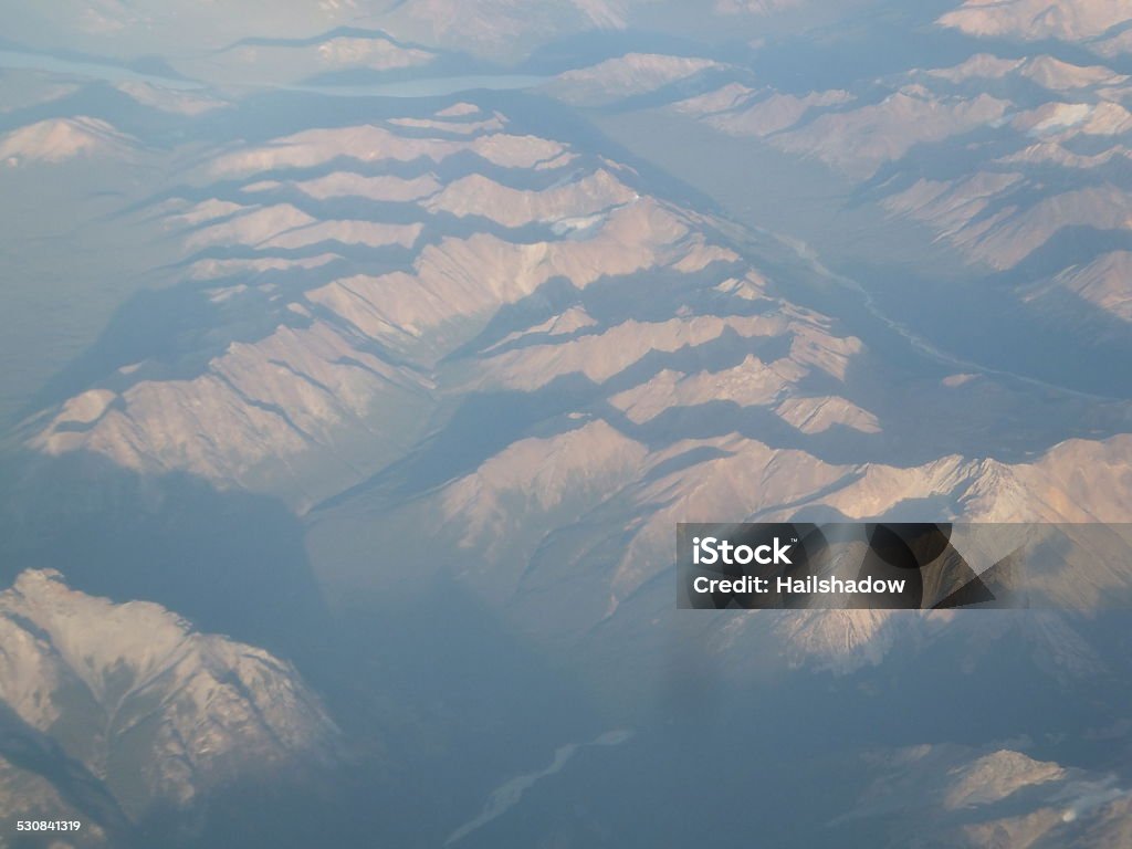 mountain aerial view Snow and ice covered mountains viewed from an aircraft. 2015 Stock Photo
