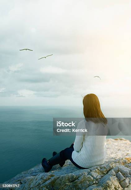 Young Woman Dreaming On Cliff Stock Photo - Download Image Now - 2015, Absence, Adult