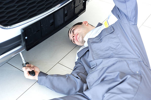 istock Male mechanic under car 530842773