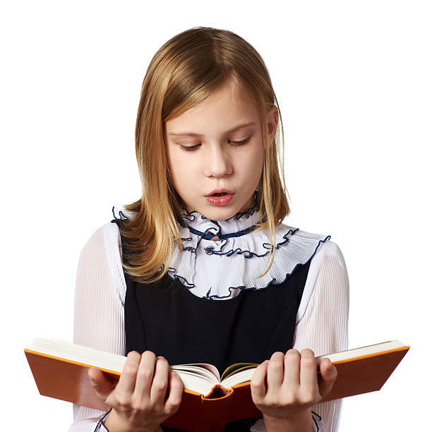 istock Schoolgirl reading book 530844275