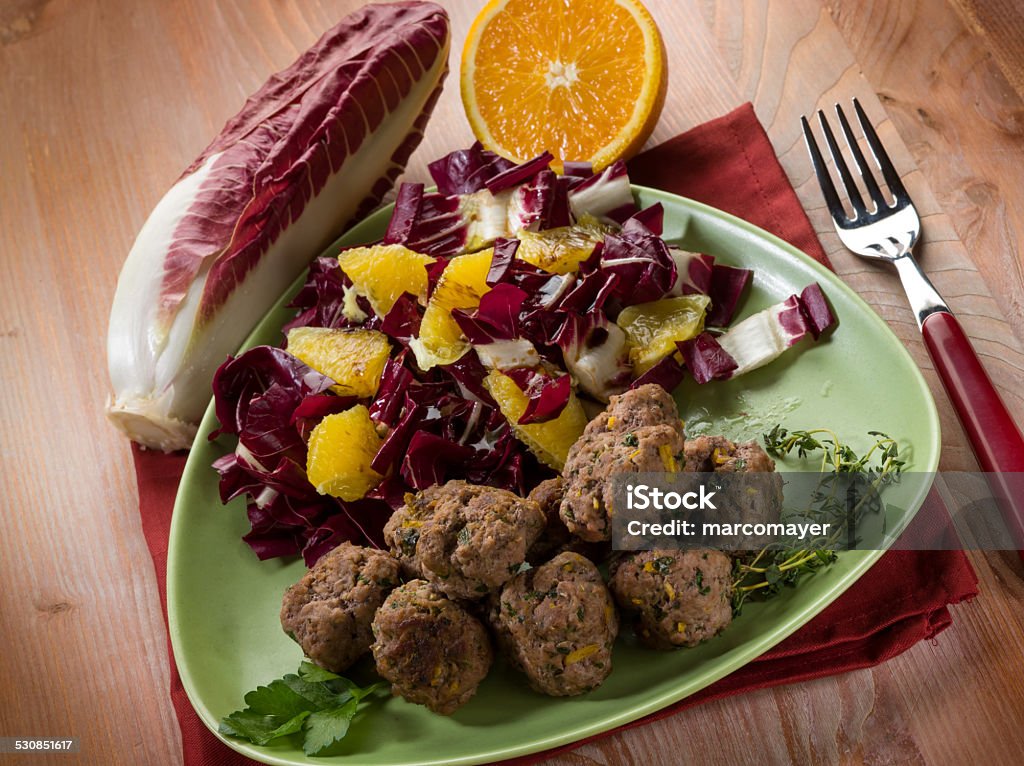 meatball with red chicory and orange salad Beef Stock Photo