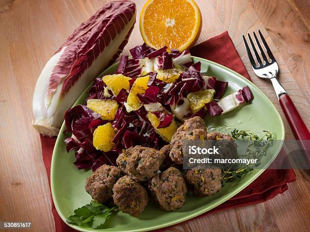 Meatball With Red Chicory And Orange Salad Stock Photo - Download Image Now - Beef, Chicory, Chopped Food