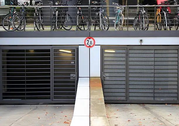City parkinglot entrance with bicycles on top