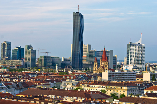 Vienna skyline at sunset, contrast between modern skycrapers and old style buildings, Austria