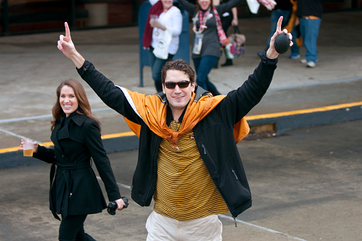 Atlanta, GA, USA - December 6, 2014:  A University of Missouri fan makes the number one gesture as he walks toward the Georgia Dome for the SEC Championship game against Alabama.