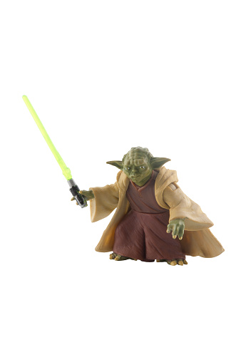 Adelaide, Australia - December 30, 2014: A Studio shot of a Yoda Action figure from the Star Wars Movie Series. Star Wars is one of the most popular movie series of all time.