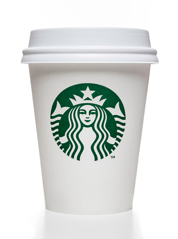 Miami, USA - October 20, 2014: Starbucks white cardboard  coffee cup with cap. studio shot, isolated on white