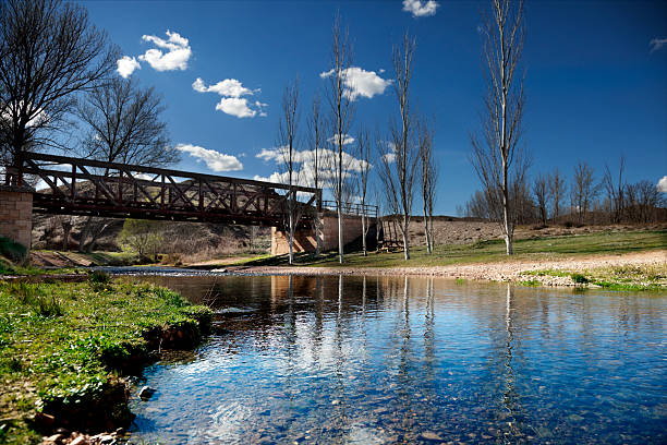 istock Beautiful river landscape with railroad iron bridge 530860235
