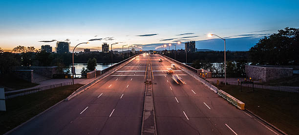 istock Traffic driving over a bridge as dusk settles. 530862599