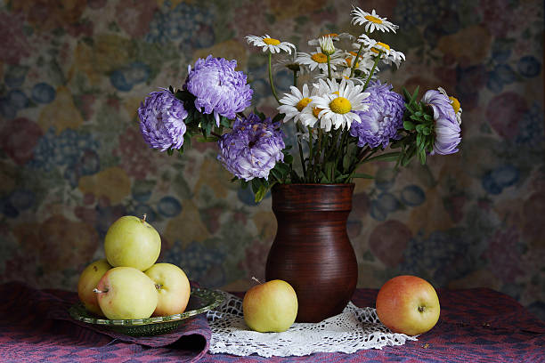 istock Classical still life with apples and beautiful flowers 530862907
