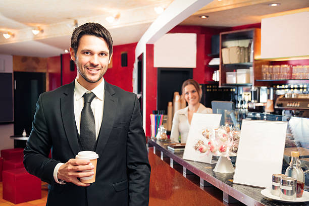 istock businessman getting his early-morning coffee 530862929