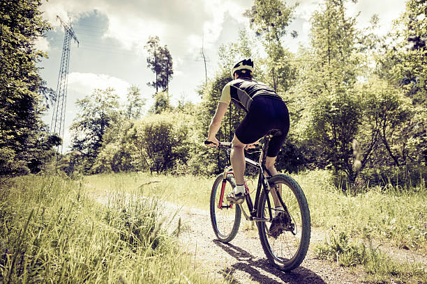 istock young man riding his mountain bike 530863383