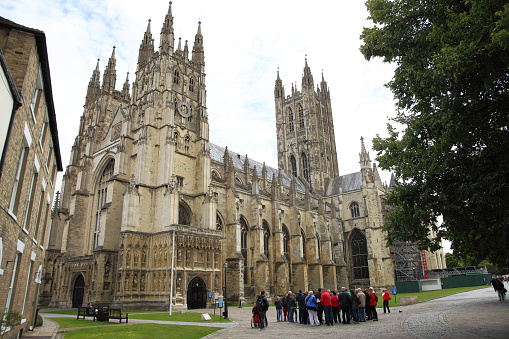 Canterbury,England-19th August 2014:A large group of tourists are about to be given a tour of the famous Christian structure and part of the World Heritage site-Canterbury Cathedral.