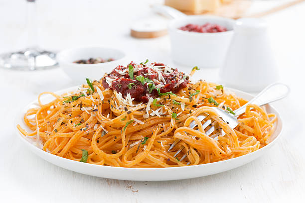 istock pasta with tomato sauce and parmesan cheese on plate, close-up 530864373