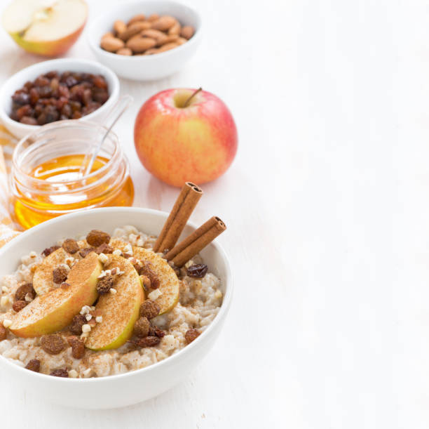 istock oatmeal with fresh apples, raisins, cinnamon and ingredients 530864385