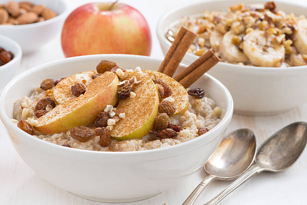 istock oatmeal with fresh apples, raisins and cinnamon for breakfast 530864721