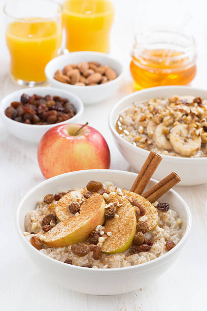 istock oatmeal with fresh apples, raisins and cinnamon for breakfast 530864801