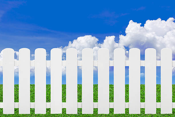 istock Picket fence on green grass. 530864997