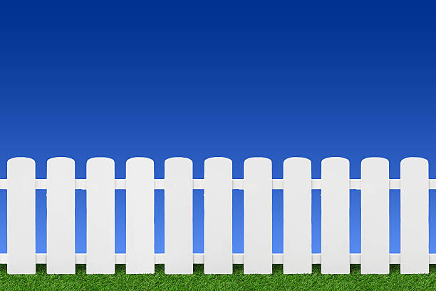 istock Wooden fence on green grass. 530866635