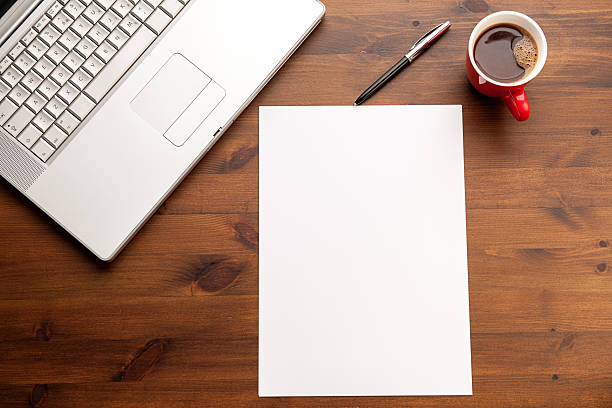 istock Laptop paper and coffee on the desk 530867015
