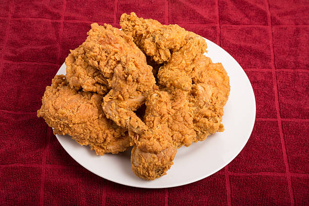 istock White Plate of Fried Chicken on Red Towel 530867395