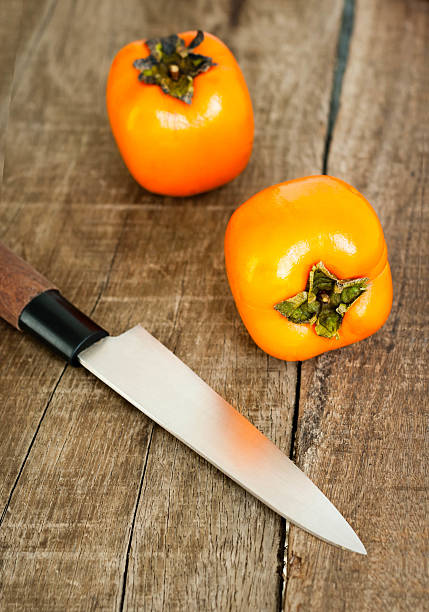 istock Fresh ripe persimmon on a wooden table 530871145