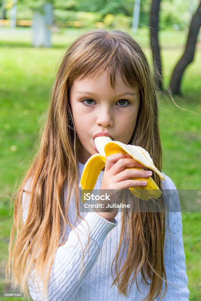 Girl Are Eating Banana Stock Photo - Download Image Now - 6-7 Years, 8 ...