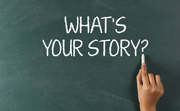istock Human Hand Writing What is Your Story? 530871411