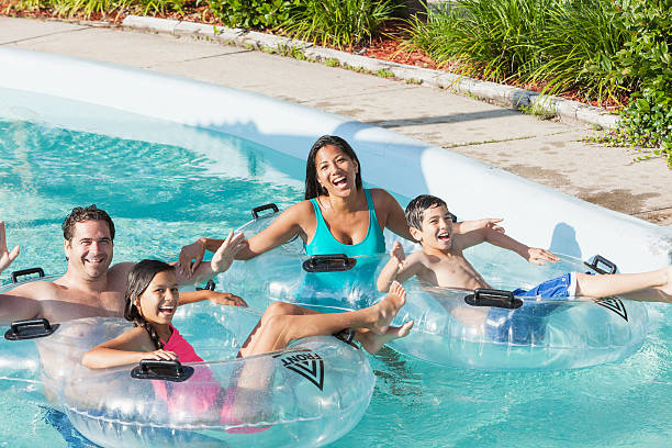 istock Family at water park on the lazy river 530871503