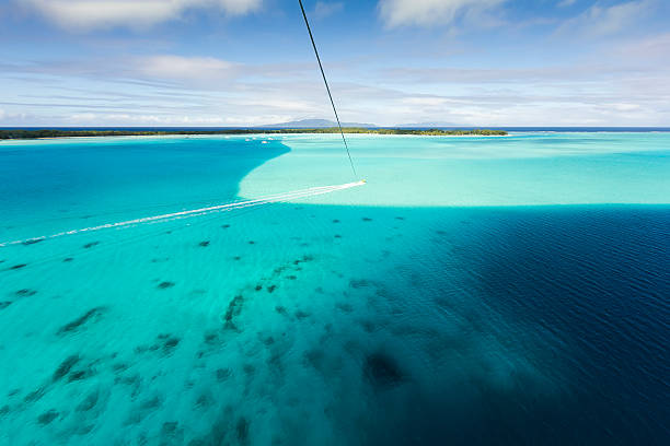 istock Parasaling in Bora Bora Over Turquoise Water 530871583