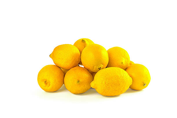 bunch of fresh yellow lemons isolated on white background stock photo