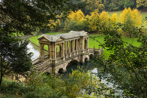 A top-down view of the Palladian Bridge in Bath's Prior Park, UK.