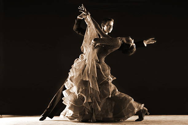 istock dancers in ballroom isolated on black background 530872391