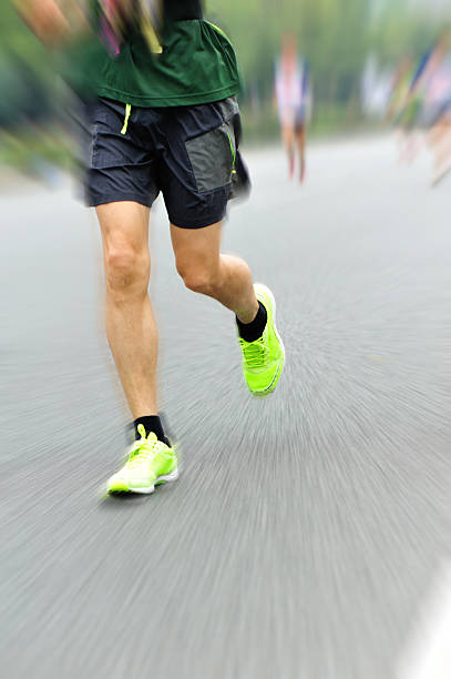 istock marathon runner athlete running on city road 530872771