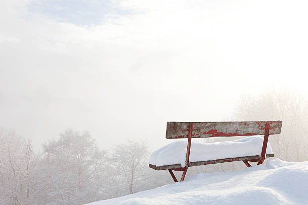 red bench empty desolate winter landscape