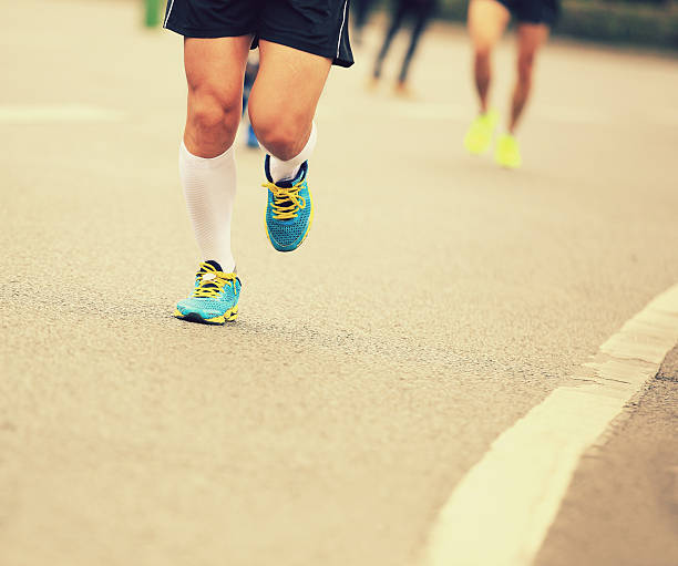 istock marathon runner athlete running on city road 530875469