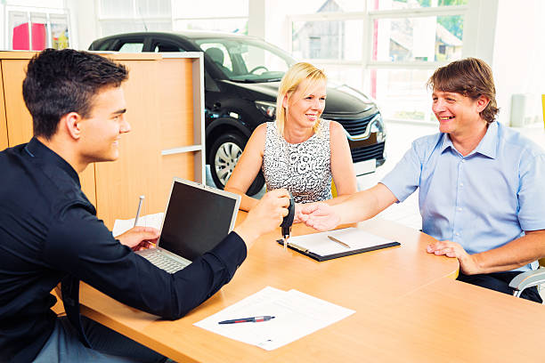 istock couple buying a new car 530876219