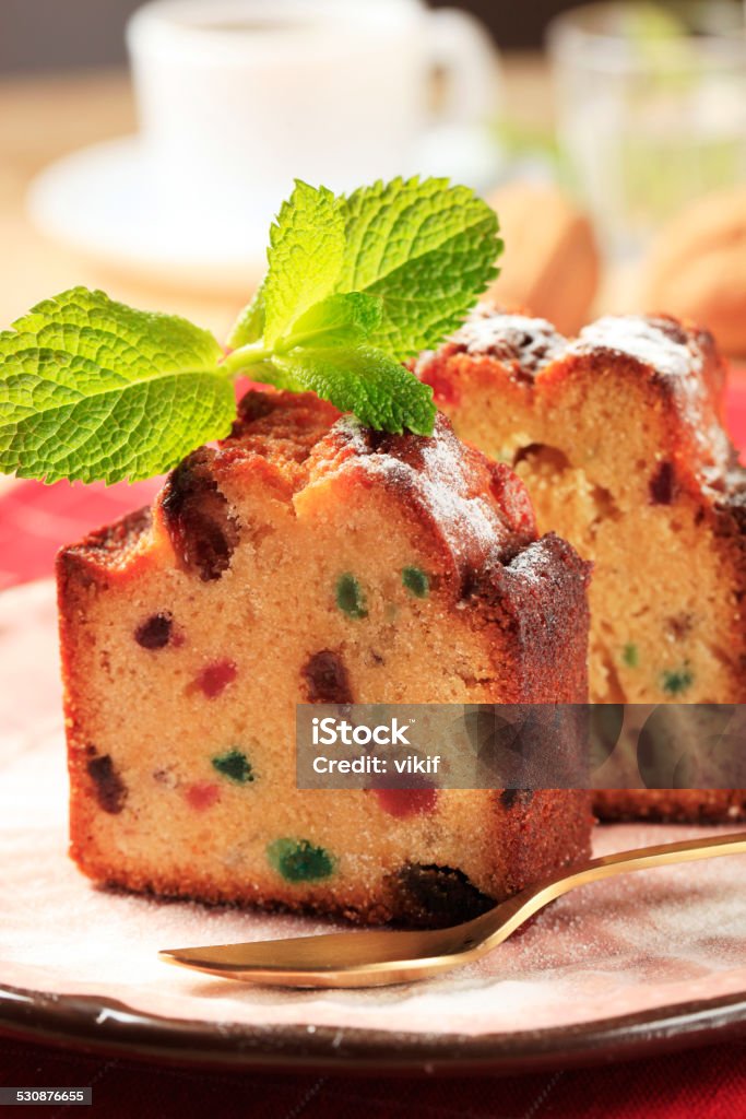 Slices of fruit cake Two pieces of fruit cake on plate Afternoon Tea Stock Photo